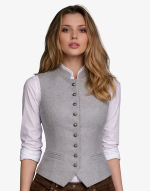 Woman wearing a gray vest over a white shirt on a white background
