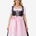 Full front view of model wearing timeless Bavarian dirndl dress with lace blouse, pink apron bow and traditional alpine fit