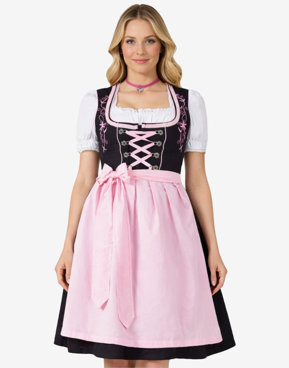 Full front view of model wearing timeless Bavarian dirndl dress with lace blouse, pink apron bow and traditional alpine fit