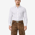 Model wearing timeless Bavarian lederhosen for men in brown leather with traditional embroidery and classic belt buckle