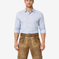 Model wearing Trachten classic lederhosen for men in brown leather with traditional Bavarian embroidery