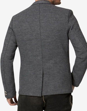 Back view of traditional alpine jacket for men showing tailored seams, structured shoulders and classic Bavarian Trachten fit.