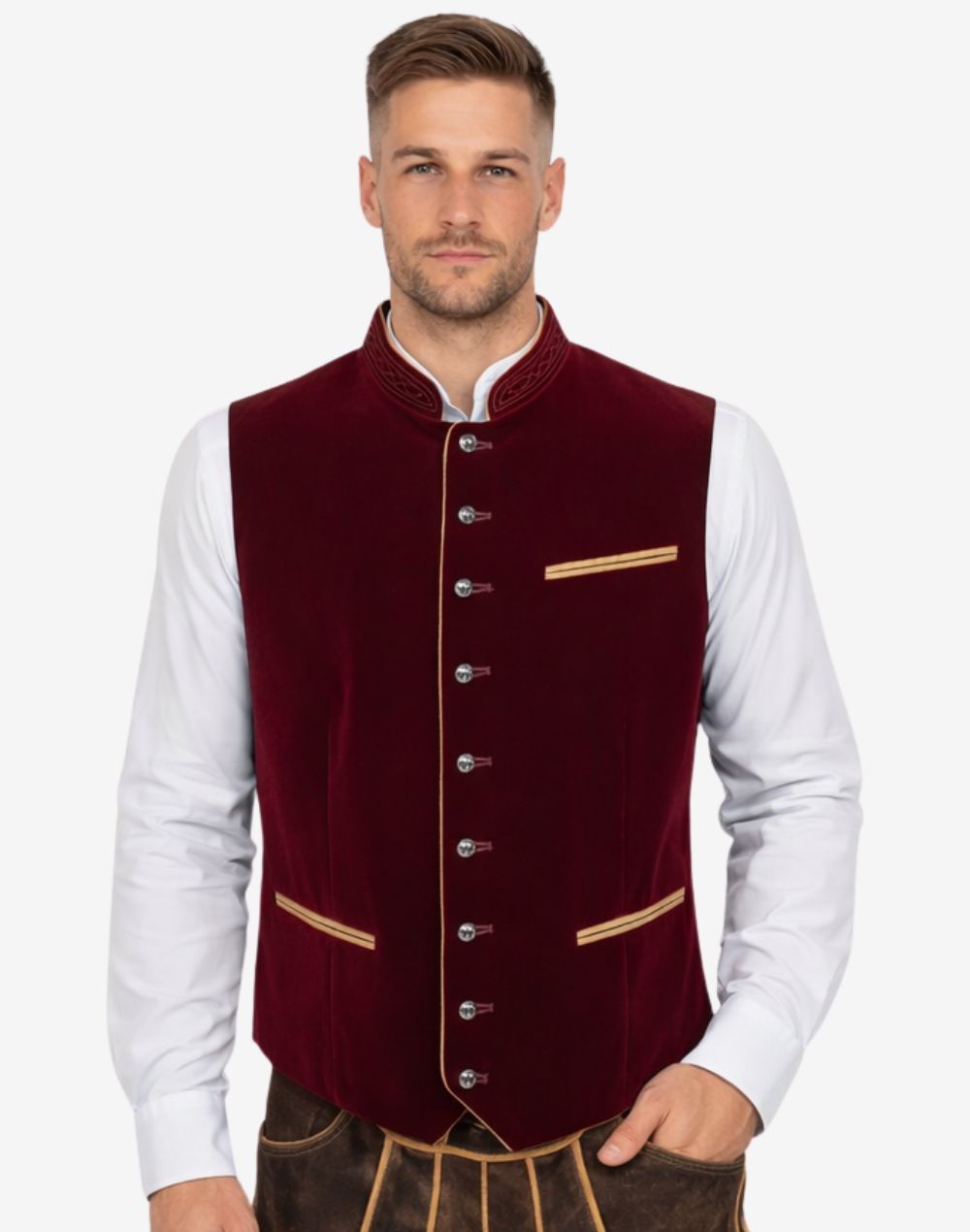 Model wearing traditional Alpine vest for men paired with shirt and lederhosen for authentic Bavarian Oktoberfest outfit.