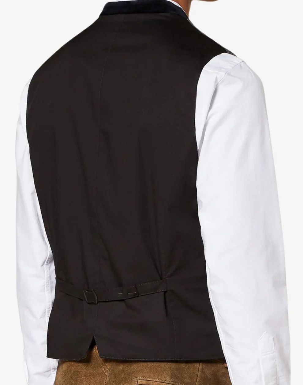 Black vest over a white shirt on a plain background