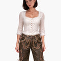 Woman wearing a traditional outfit with a white blouse and brown shorts on a white background