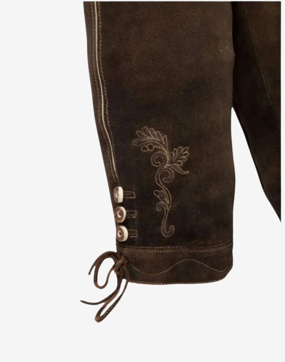 Side detail of traditional bundhosen highlighting embroidered pattern, decorative buttons and knee tie on premium leather finish