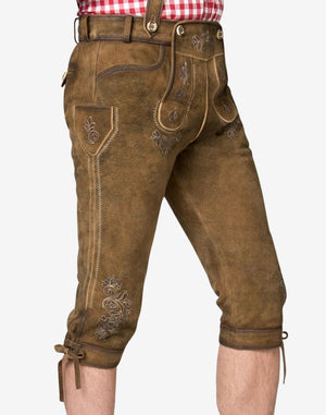Side view of traditional German bundhosen highlighting leg embroidery, side pocket design and premium leather texture.