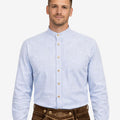 Model wearing traditional Oktoberfest shirt for men displaying blue check design, button closure and classic Bavarian look