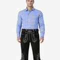 Front view of model wearing vintage German Bundhosen for men in black leather with Bavarian embroidery and traditional knee tie design