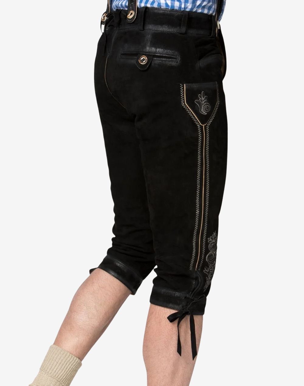 Rear side view of black leather Bavarian Bundhosen featuring the embroidered knife pocket, buttoned rear pocket, decorative side stitching, and lace-up cuff.