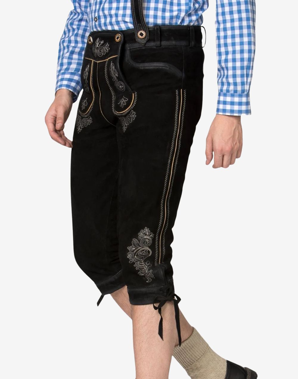 Angled side view of black leather Bundhosen showing grey floral embroidery, decorative side stitching, embroidered knife pocket, and lace-up knee cuff.