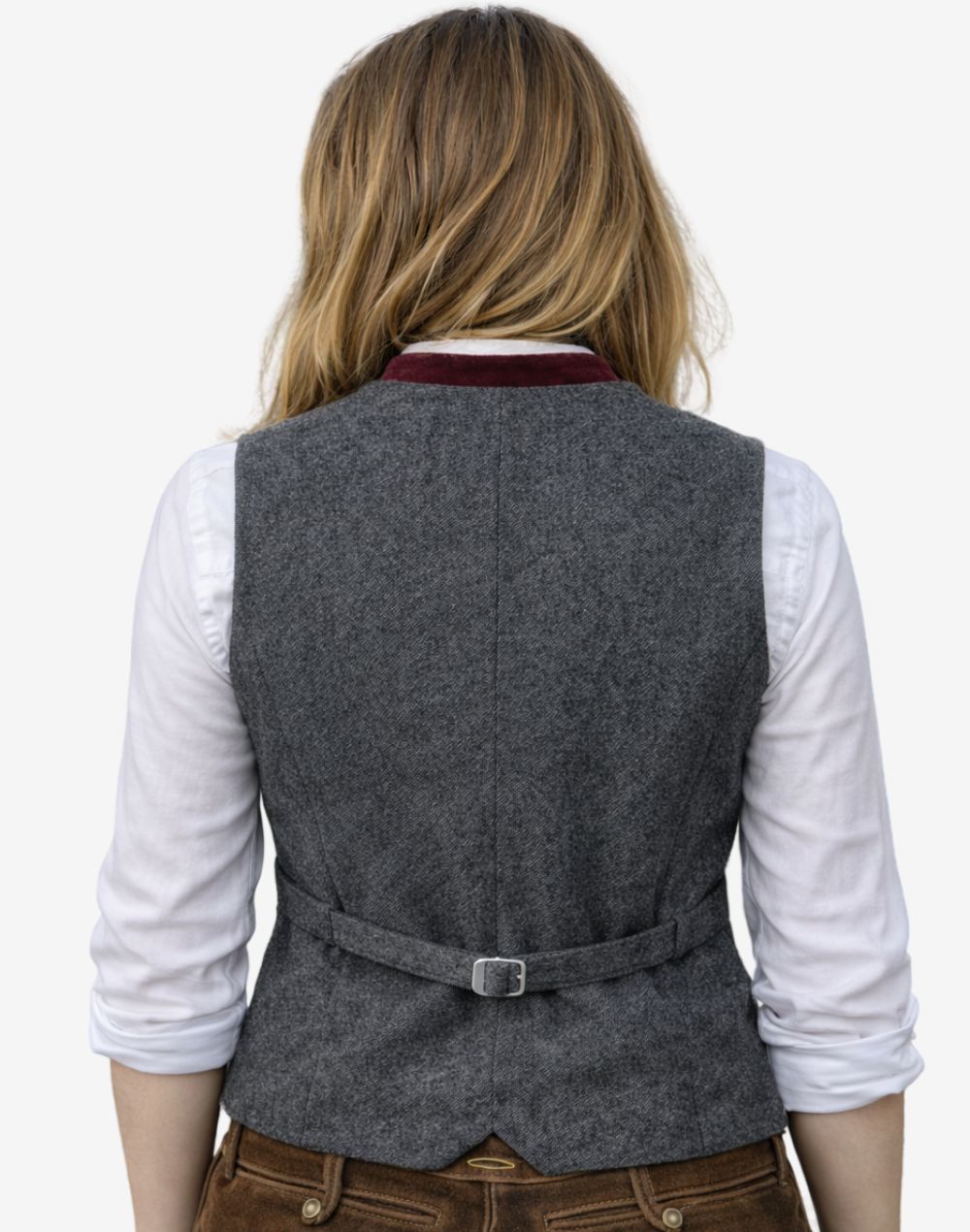 Back view of women red velvet trachten waistcoat showing adjustable belt, tailored fit, textured fabric and traditional alpine styling detail