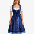 A woman modeling a traditional German dirndl dress with a navy blue bodice and skirt, white puffed sleeves, and a white embroidered neckline, set against a plain light gray background.