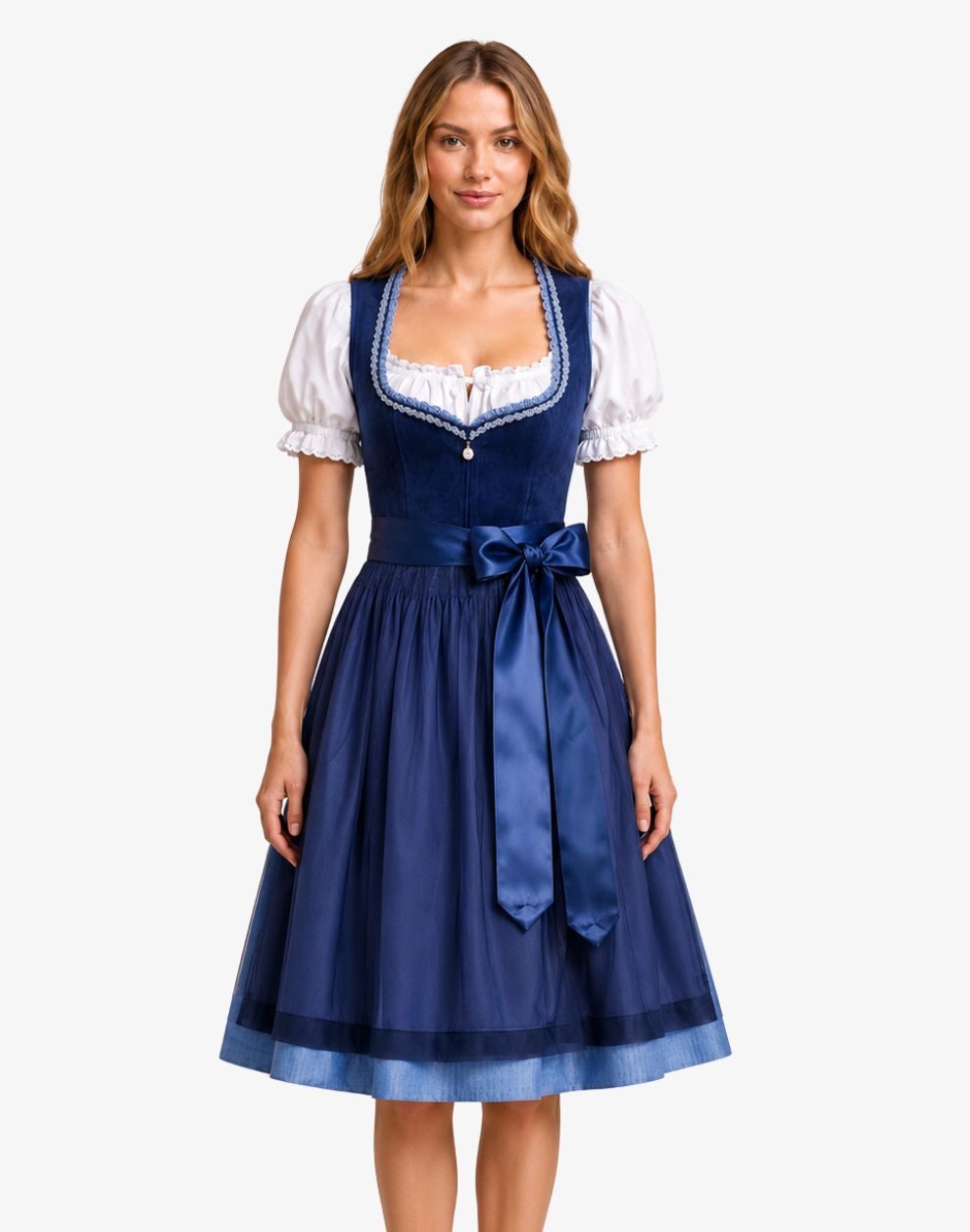 A woman modeling a traditional German dirndl dress with a navy blue bodice and skirt, white puffed sleeves, and a white embroidered neckline, set against a plain light gray background.