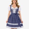 Model wearing elegant traditional dirndl dress showing navy star print, lace trim bodice, apron bow and classic fit