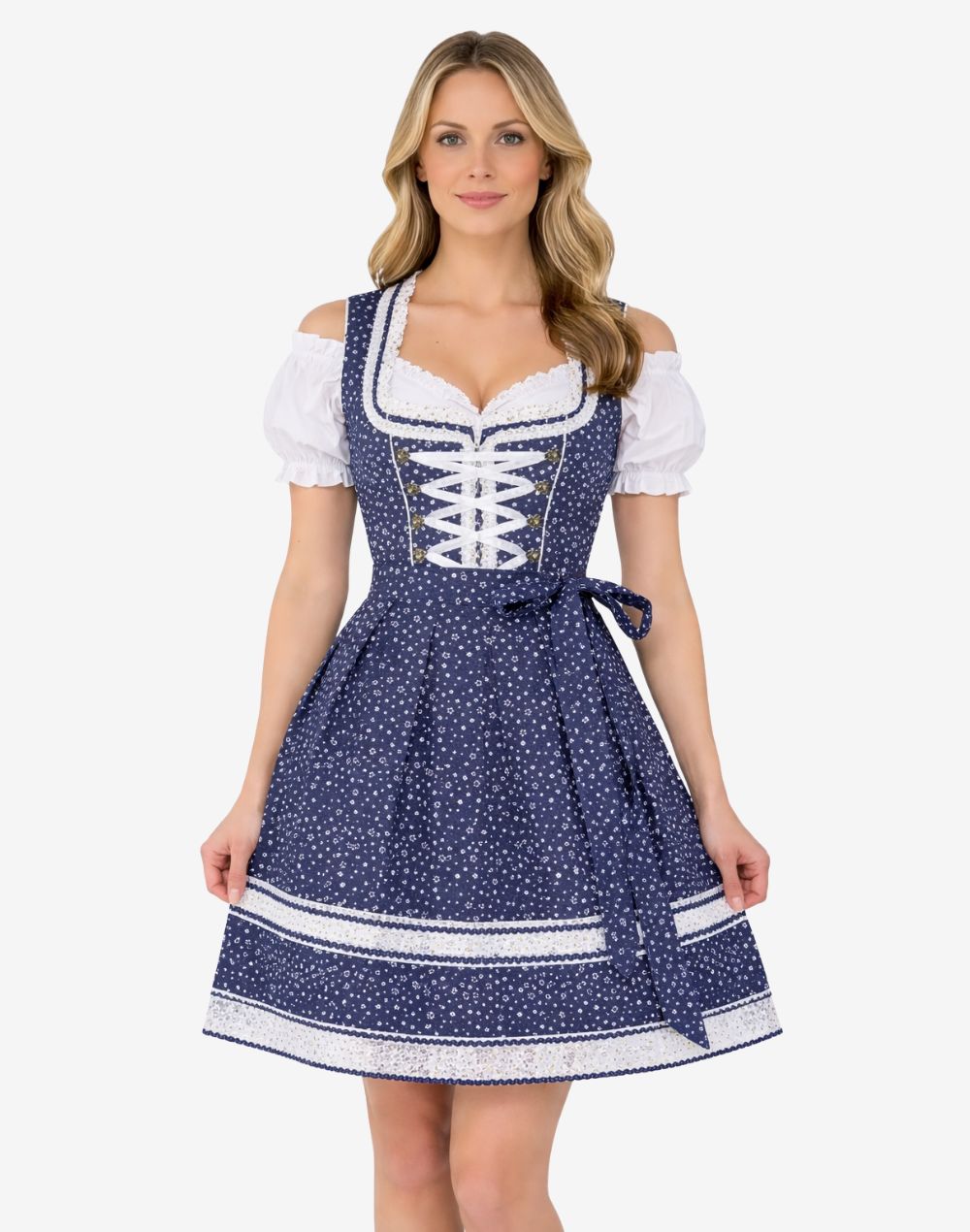 Model wearing elegant traditional dirndl dress showing navy star print, lace trim bodice, apron bow and classic fit