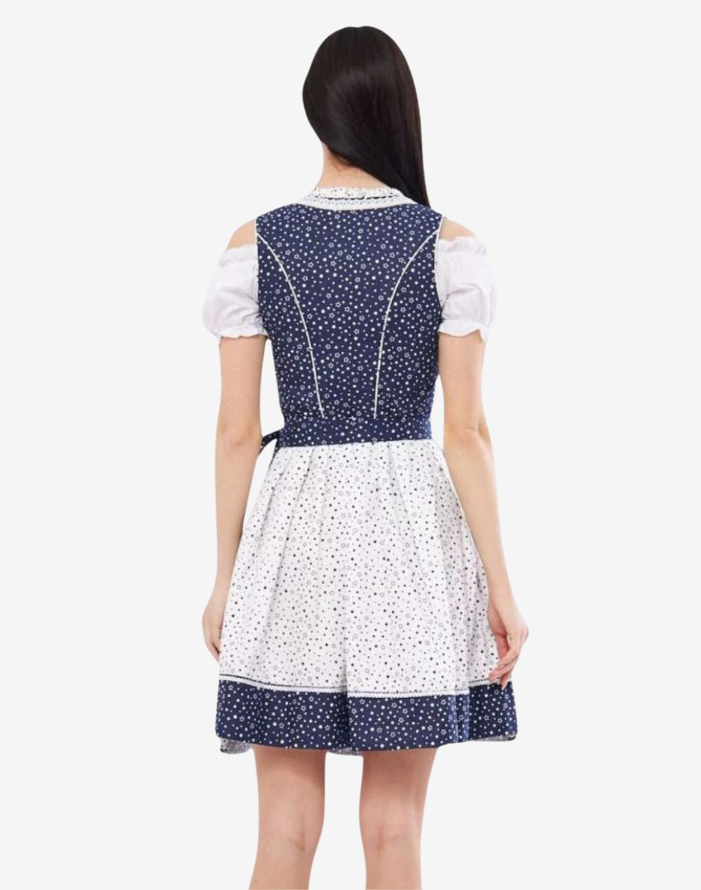 Rear view of model wearing elegant traditional dirndl dress showing fitted back, star print bodice and apron detail