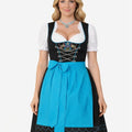 Full front view of model wearing traditional Oktoberfest dirndl dress with black skirt, blue apron and decorative bodice design