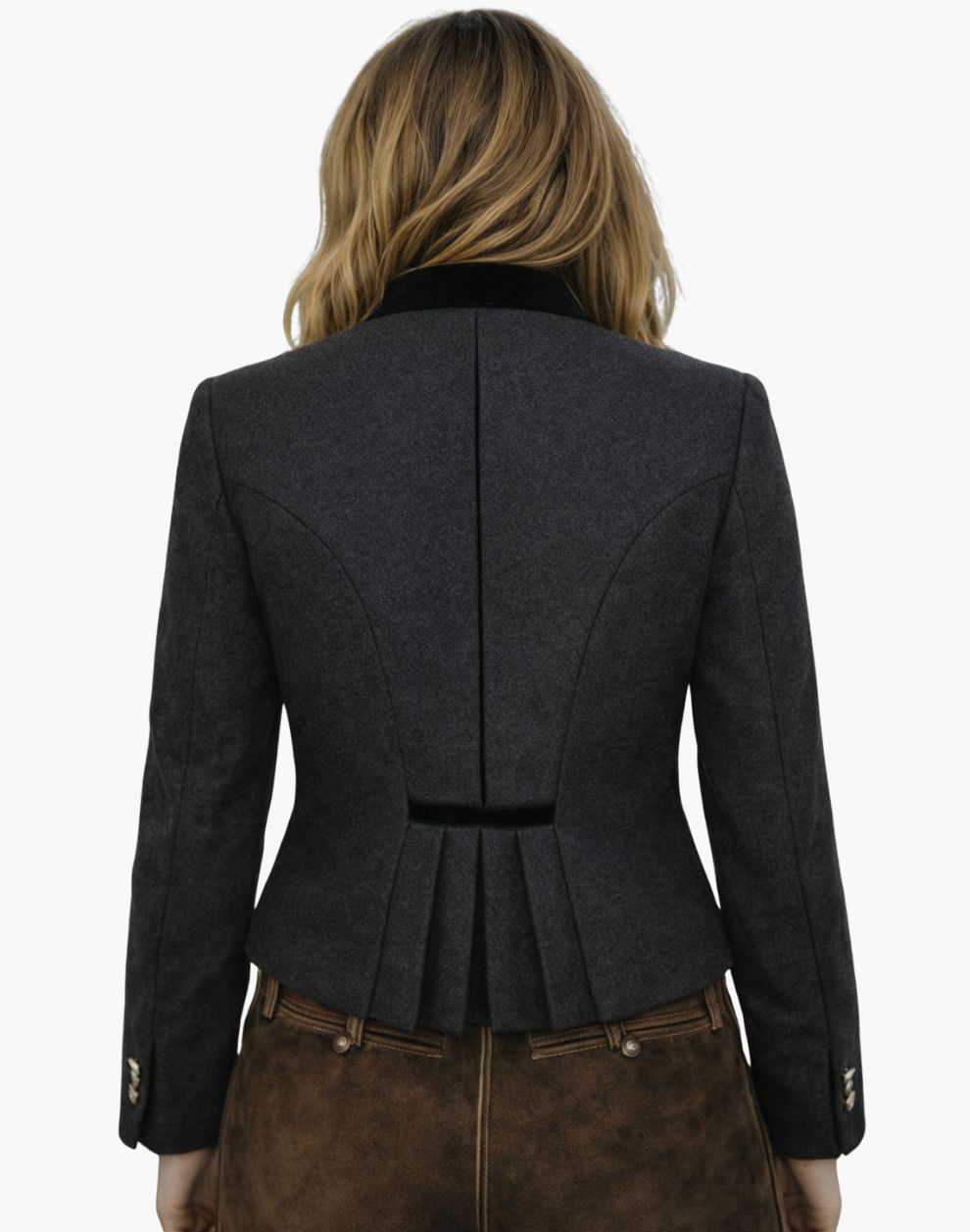 Back view of a woman wearing a traditional German Trachten jacket in dark grey with a fitted waist, pleated back detail, and tailored Bavarian design, paired with brown lederhosen, against a white background.