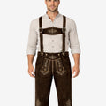 Model wearing dark brown genuine leather Bundhosen with embroidered leather suspenders, floral front flap embroidery, and adjustable lace-up knee openings.