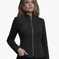 Woman wearing a dark gray jacket on a white background