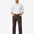 Man wearing a white shirt and brown pants on a white background