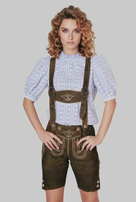 A curly hair women showing lederhosen detailing.