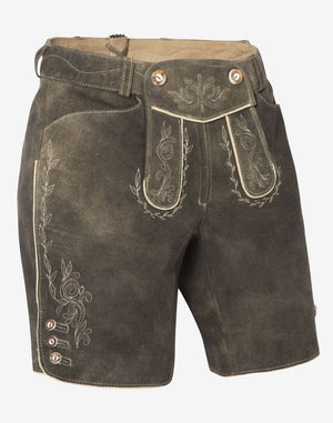 Front view of women’s Oktoberfest-style brown leather lederhosen shorts featuring traditional embroidered patterns, decorative front flap, side buttons, and contrast stitching.